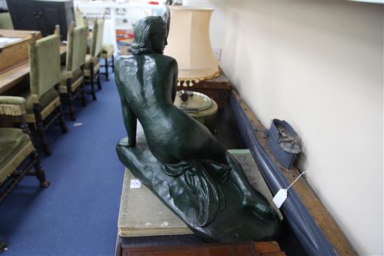 Cipriani. A green patinated terracotta figure of a kneeling woman(-)